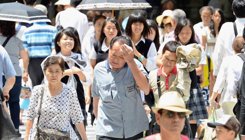 People walking under extreme summer heat