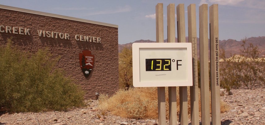 Digital thermometer shows 132°F during extreme heatwave.