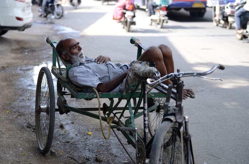 Man rests during hot weather in India