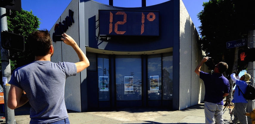People taking photos of extreme heat reading during US heat wave